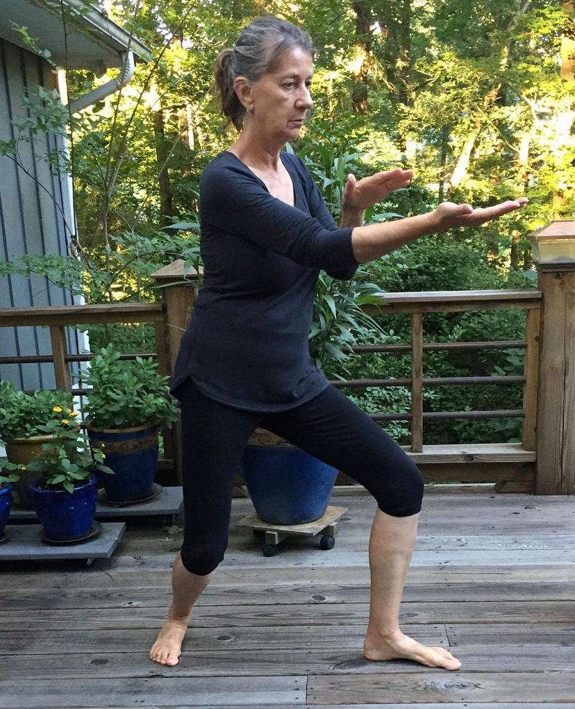 Rebecca Brooks practicing Tai Chi outside