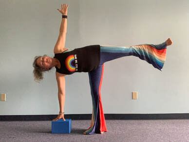 Clarissa Boggess in half-moon pose