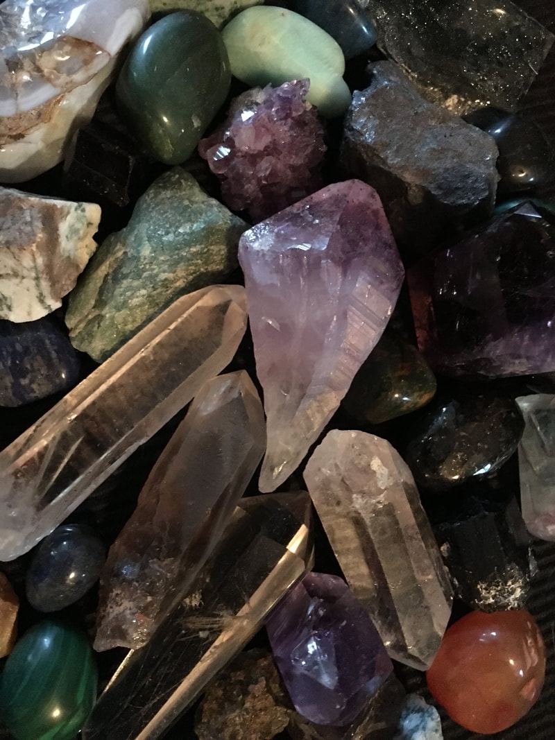 A curated layout of crystals and tools