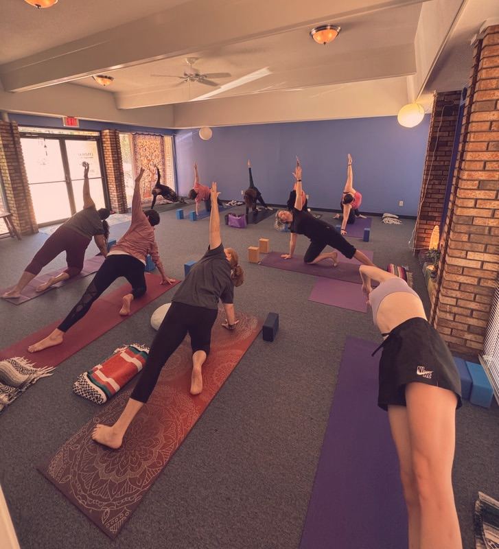 A practitioner in side plank pose